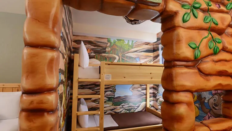 The cabin and bunk beds in the Junior Wolf Pup Den Suite